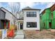 New construction home with white siding and a gray door at 1647 Sheldon St, Indianapolis, IN 46218