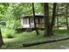 Quaint lakeside cabin nestled amongst the trees at 9100 S Us Highway 35, Muncie, IN 47302