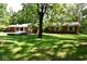 Brick ranch house with large backyard and mature trees at 9100 S Us Highway 35, Muncie, IN 47302