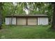 Detached two-car garage with light yellow doors at 9100 S Us Highway 35, Muncie, IN 47302