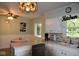 Bright kitchen with white cabinets and eat-in area at 9100 S Us Highway 35, Muncie, IN 47302