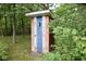 Rustic outhouse with painted wood siding at 9100 S Us Highway 35, Muncie, IN 47302