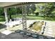 Serene backyard oasis with a pond and lush landscaping at 9100 S Us Highway 35, Muncie, IN 47302
