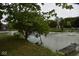 Serene pond with wooden dock and lush greenery at 9100 S Us Highway 35, Muncie, IN 47302
