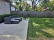 Spacious backyard with a patio, fire pit and a wooden fence at 1344 Barth Ave, Indianapolis, IN 46203