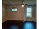 Relaxing bedroom with dark hardwood floors and a marble-textured wall at 1344 Barth Ave, Indianapolis, IN 46203