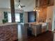 Modern kitchen with a farmhouse sink, granite countertops, and exposed brick details at 1344 Barth Ave, Indianapolis, IN 46203