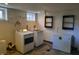 Convenient laundry room with washer, dryer, and extra storage at 1344 Barth Ave, Indianapolis, IN 46203