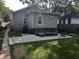 Private backyard with patio, fire pit, and plenty of grass space at 1344 Barth Ave, Indianapolis, IN 46203