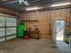 Unfinished garage with workbench and storage shelving at 1344 Barth Ave, Indianapolis, IN 46203