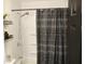 Clean bathroom with shower/tub combo and patterned shower curtain at 2312 E 22Nd St, Muncie, IN 47302