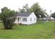 House with a large grassy backyard and a fenced perimeter at 2312 E 22Nd St, Muncie, IN 47302