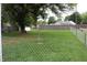 Backyard with fenced area and large tree at 2312 E 22Nd St, Muncie, IN 47302