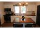 Modern white kitchen with wood countertops and subway tile backsplash at 2312 E 22Nd St, Muncie, IN 47302