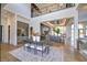 Elegant dining room with a large wooden table and modern light fixture at 9760 Windy Hills Dr, Zionsville, IN 46077