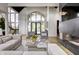 Bright living room featuring a fireplace and high ceilings at 9760 Windy Hills Dr, Zionsville, IN 46077
