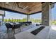 Relaxing patio with seating area and fire pit at 9760 Windy Hills Dr, Zionsville, IN 46077