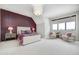 Spacious bedroom with a statement wall and seating area at 9760 Windy Hills Dr, Zionsville, IN 46077