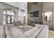 Open living room with a stunning fireplace and large windows at 9760 Windy Hills Dr, Zionsville, IN 46077