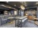 Sophisticated basement bar with seating and a modern design at 9760 Windy Hills Dr, Zionsville, IN 46077