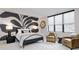 Serene bedroom with a large artistic wall and two armchairs at 9760 Windy Hills Dr, Zionsville, IN 46077