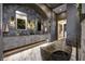 Primary bathroom with freestanding soaking tub and double vanity at 9760 Windy Hills Dr, Zionsville, IN 46077
