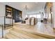 Open living area with hardwood floors, comfortable seating, and built-in shelving at 9760 Windy Hills Dr, Zionsville, IN 46077