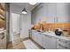 Modern butler's pantry with quartz countertops and ample cabinetry at 9760 Windy Hills Dr, Zionsville, IN 46077