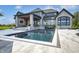 Luxury backyard pool with stone patio and lounge chairs at 9760 Windy Hills Dr, Zionsville, IN 46077