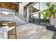Outdoor patio with seating area and stone wall at 9760 Windy Hills Dr, Zionsville, IN 46077