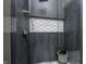 Spa-like shower with patterned tile and frameless glass enclosure at 9760 Windy Hills Dr, Zionsville, IN 46077
