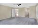 Bedroom with grey carpet, access to bathroom and kitchen at 10614 N 300 E, Morristown, IN 46161