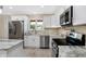 Modern kitchen featuring stainless steel appliances and granite countertops at 10614 N 300 E, Morristown, IN 46161