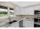 White shaker cabinets, granite countertops, and stainless steel appliances at 10614 N 300 E, Morristown, IN 46161