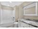 Bathroom boasts a vanity with granite countertop and a shower/tub combo at 10614 N 300 E, Morristown, IN 46161