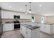 Open kitchen with a large island and granite countertops at 10614 N 300 E, Morristown, IN 46161