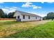 Rear view of house showing exterior and yard at 10614 N 300 E, Morristown, IN 46161