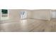 Bright and airy living room featuring light wood-look flooring at 10614 N 300 E, Morristown, IN 46161