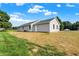 Gray house with a gray roof, and a green lawn at 10614 N 300 E, Morristown, IN 46161
