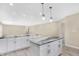 Modern kitchen featuring white cabinets, granite countertops, and an island at 10614 N 300 E, Morristown, IN 46161