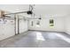 Two-car garage with automatic door openers and concrete floor at 10614 N 300 E, Morristown, IN 46161