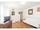 Bedroom with hardwood floors, futon, and built-in shelving at 1683 Conner St, Noblesville, IN 46060