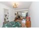 Dining room with round table and view into living room at 1683 Conner St, Noblesville, IN 46060