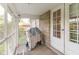 Screened porch with stone wall and access to backyard at 1683 Conner St, Noblesville, IN 46060
