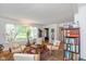 Living room with hardwood floors, large windows, and seating area at 1683 Conner St, Noblesville, IN 46060