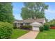 Ranch home with a stone facade and attached garage at 1683 Conner St, Noblesville, IN 46060