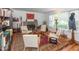 Living room with hardwood floors, fireplace, and seating area at 1683 Conner St, Noblesville, IN 46060