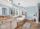 Elegant bathroom with soaking tub, double vanity, and tile floors at 6935 Linden Woods Dr, Avon, IN 46123