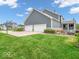 Gray house with three-car garage and basketball court at 6935 Linden Woods Dr, Avon, IN 46123