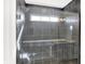 Spa-like shower with grey tile and built-in seat at 19663 Atwater Ave, Sheridan, IN 46069